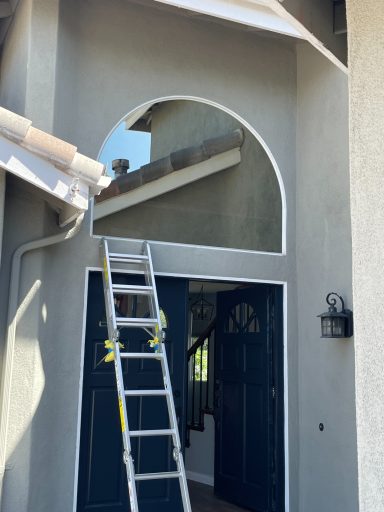 Arch with reflective glass Arch window above doorway
